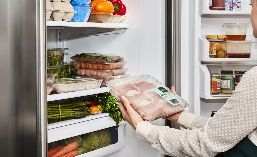 ePET tray with chicken breasts in a refrigerator