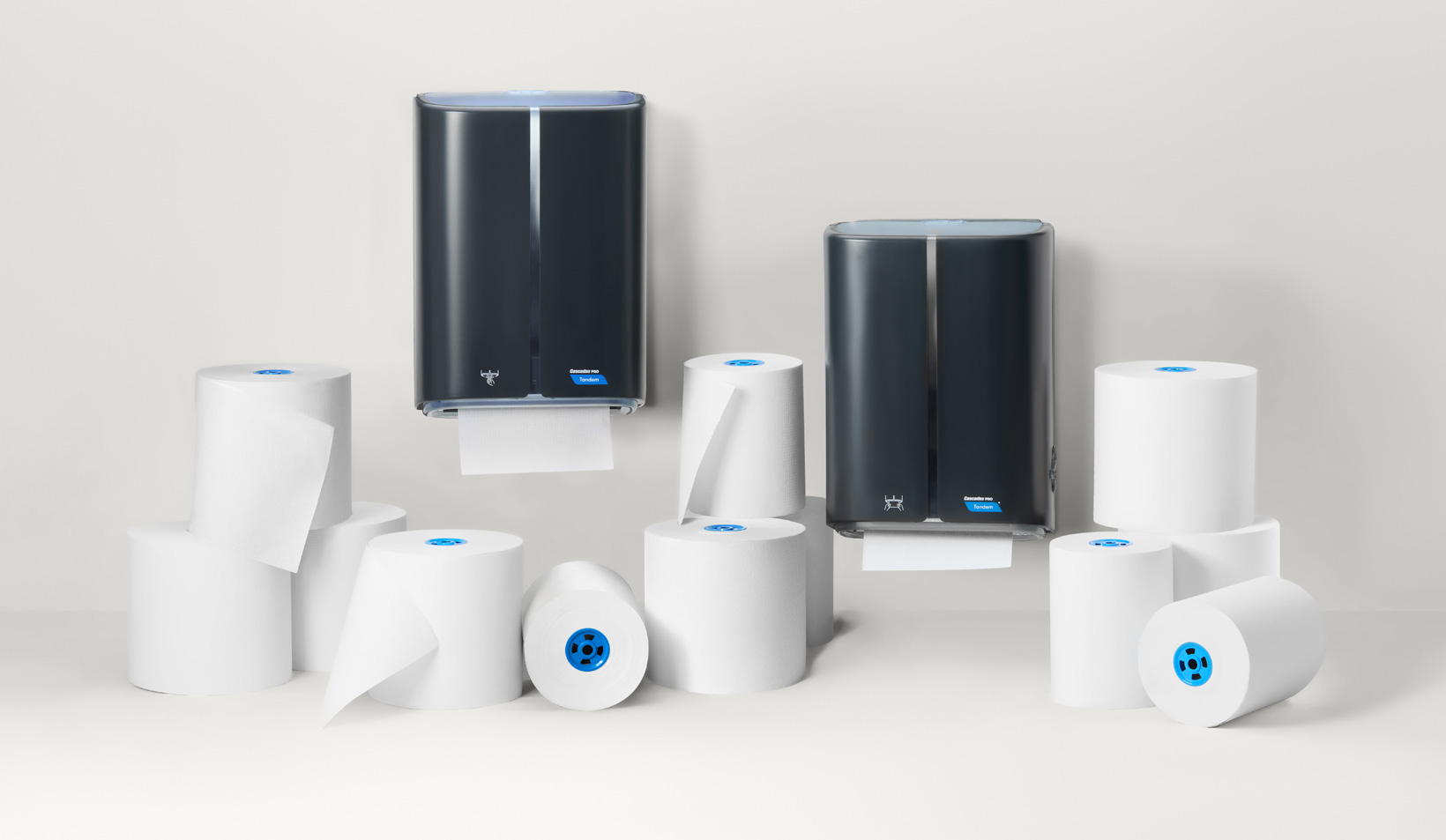 Paper towel dispensers with rolls for commercial bathrooms