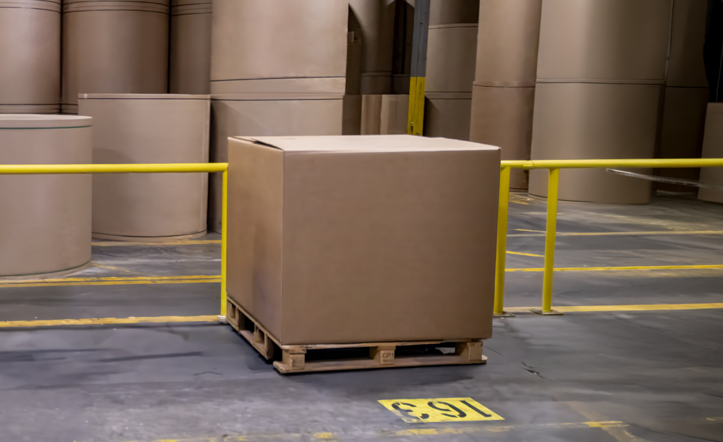 Cardboard bulk bin placed on a pallet in a paper processing plant