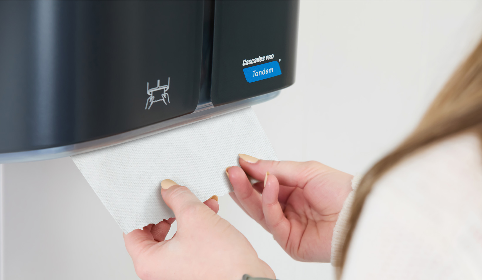 Commercial toilet paper dispenser with paper rolls – demonstration of a professional hygiene solution.
